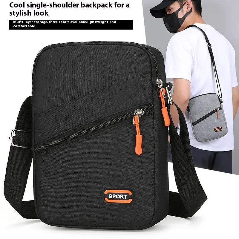 Oxford cloth commuter bag in silver grey, black, or navy blue with crossbody shoulder strap and contrast colour detailing
