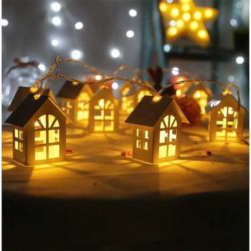 10 LED wood house fairy light string 2M with warm white glow on a Christmas tree