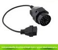 BMW diagnostic adapter cable showing 20-pin plug and standard 16-pin OBD2 socket.