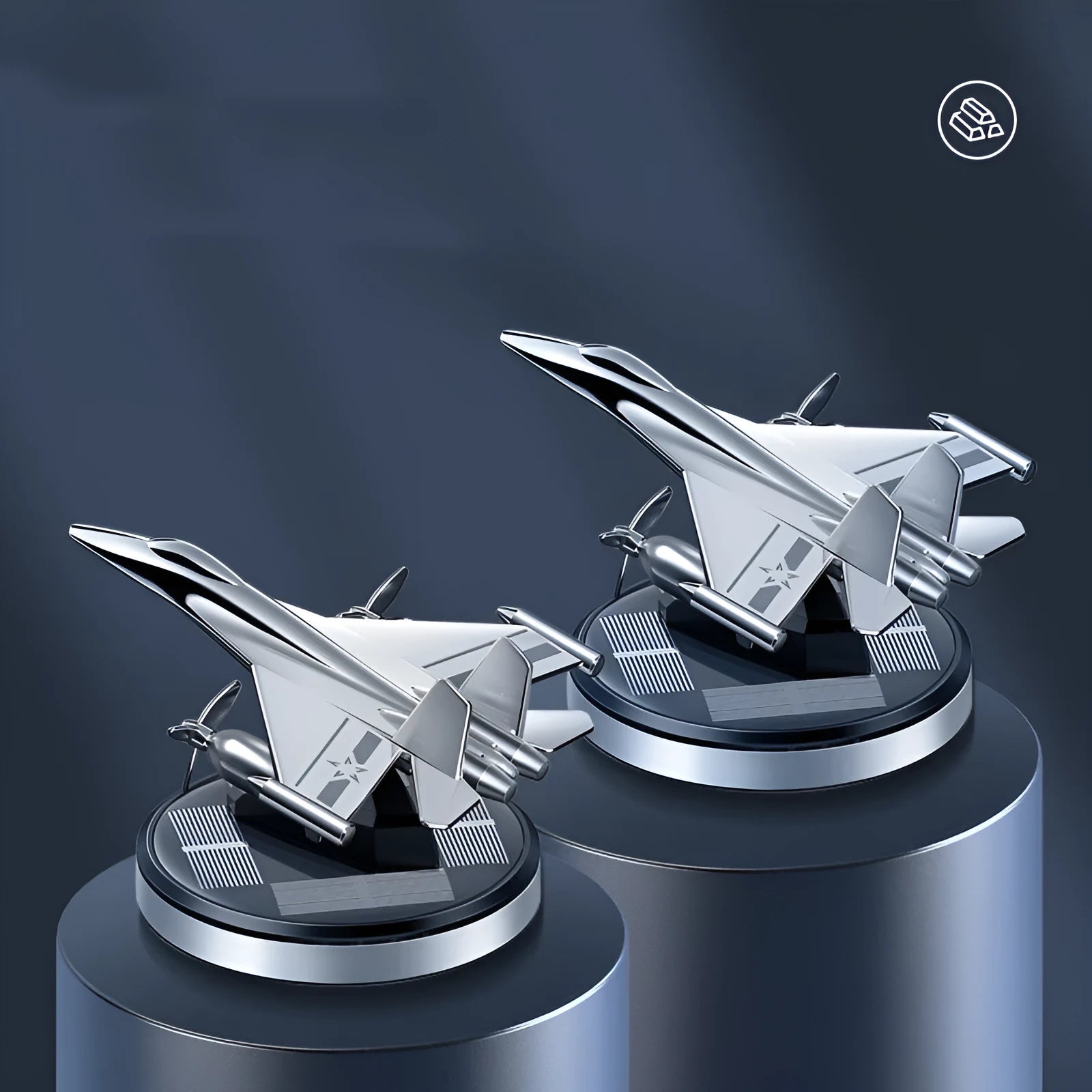 Silver solar powered rotating fighter jet perfume ornament on a wooden surface.