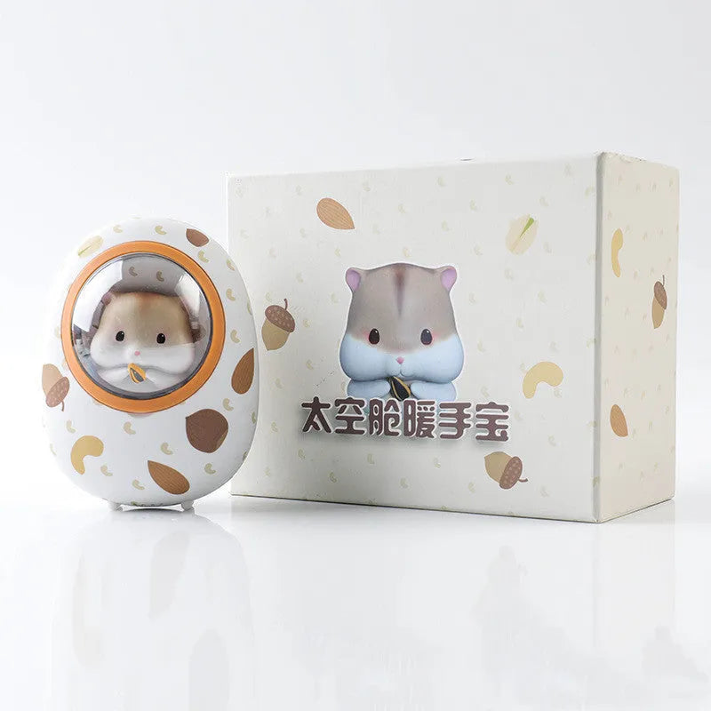 White Hamster hand warmer power bank with space capsule design showing charging port and heating controls