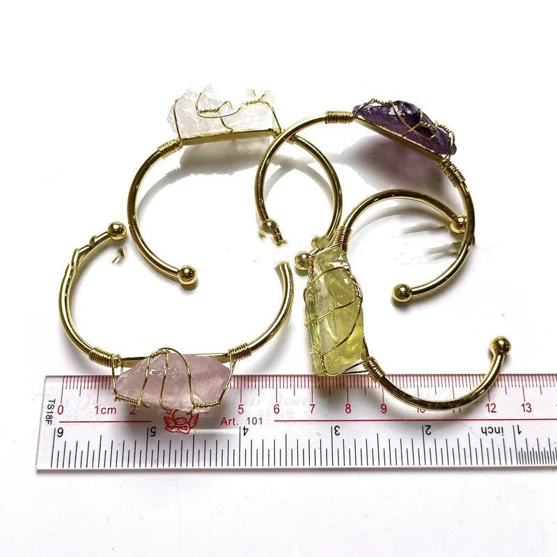 Geometric bracelet made of natural rough crystal stones wrapped with gold-coloured wire