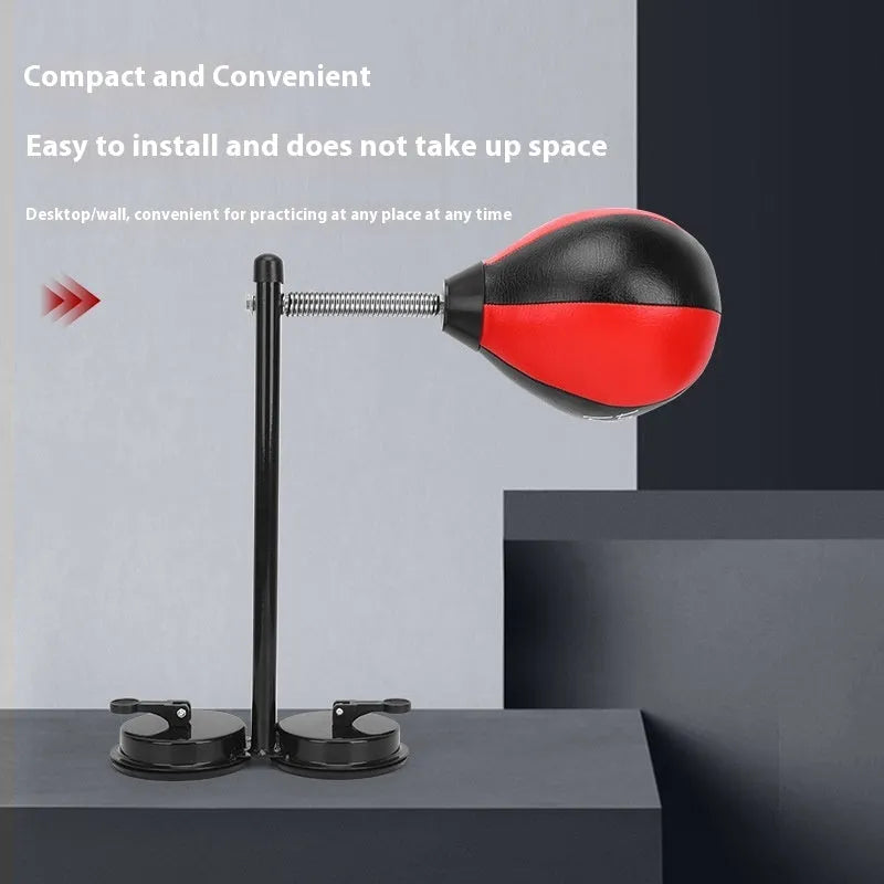 Red and black pear-shaped hanging boxing training ball with elastic cord and suction cup mount.