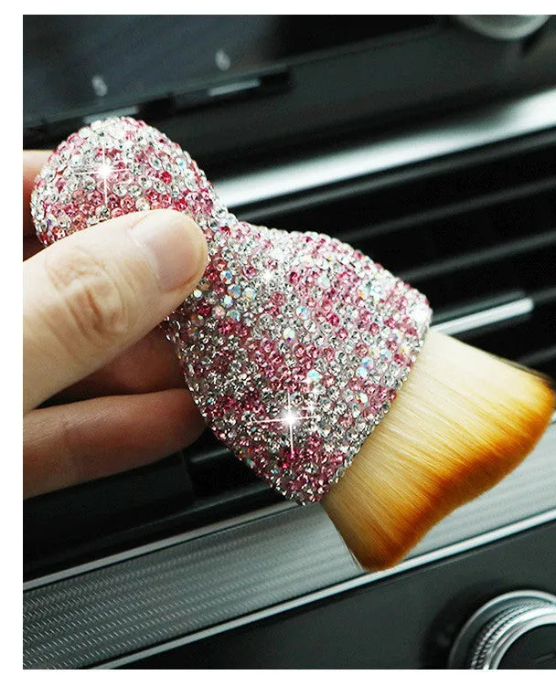 Compact white PVC soft-bristle brush for cleaning car dashboard vents and interior dust.