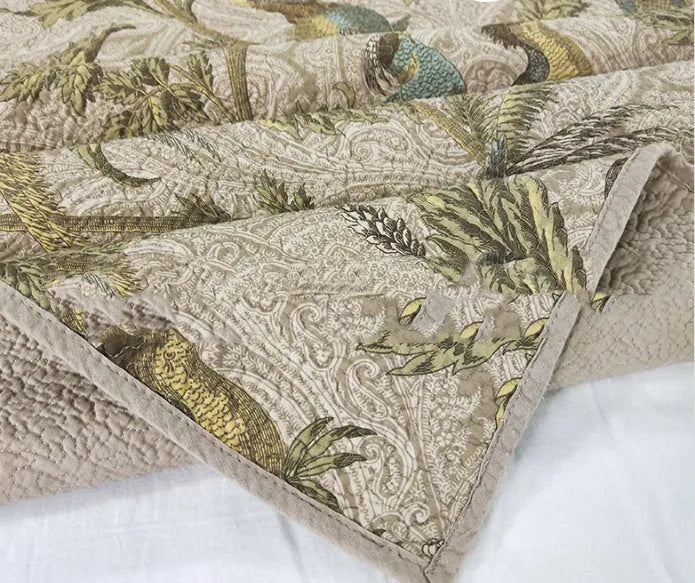 Blue American-style cotton bedspread with floral bird pattern, part of a 3-piece quilted set.