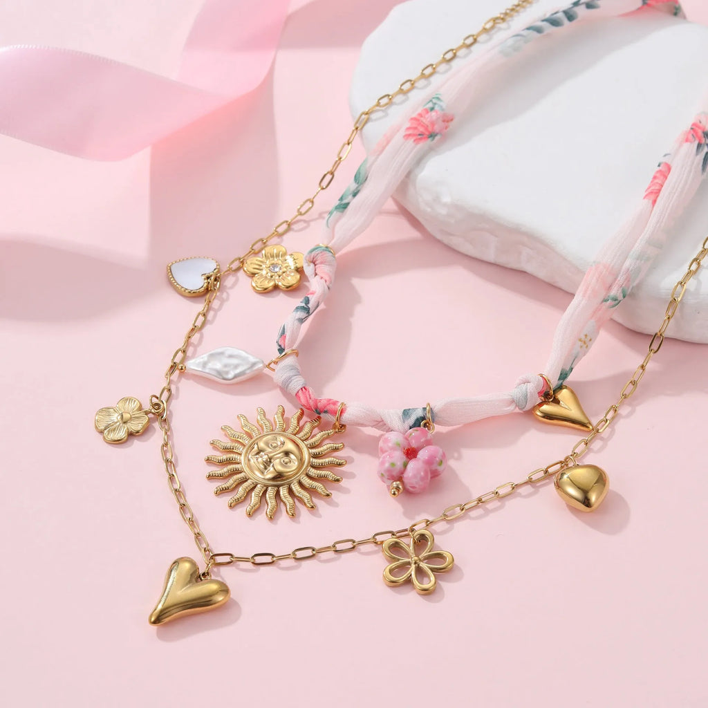 Geometric sun pendant necklace on stainless steel chain with 18K gold electroplated finish