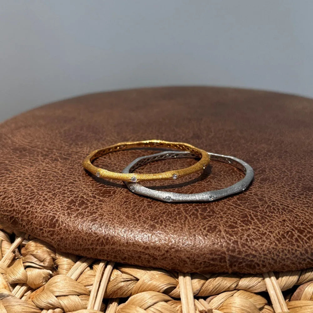 925 silver gold finish wire drawing bracelet with zircon inlay on white background