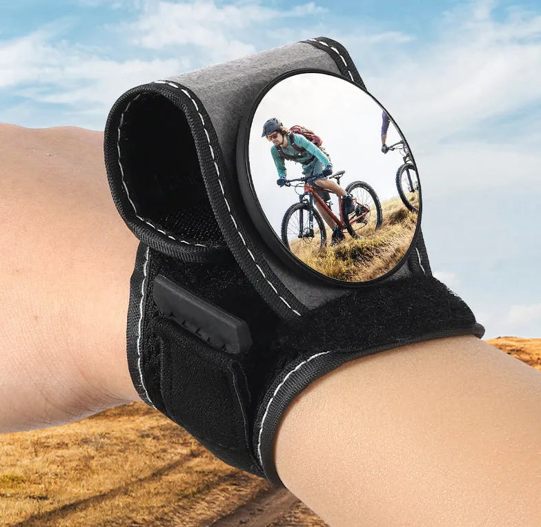 Black nylon bicycle wrist rear-view mirror with adjustable arm extended for cycling visibility