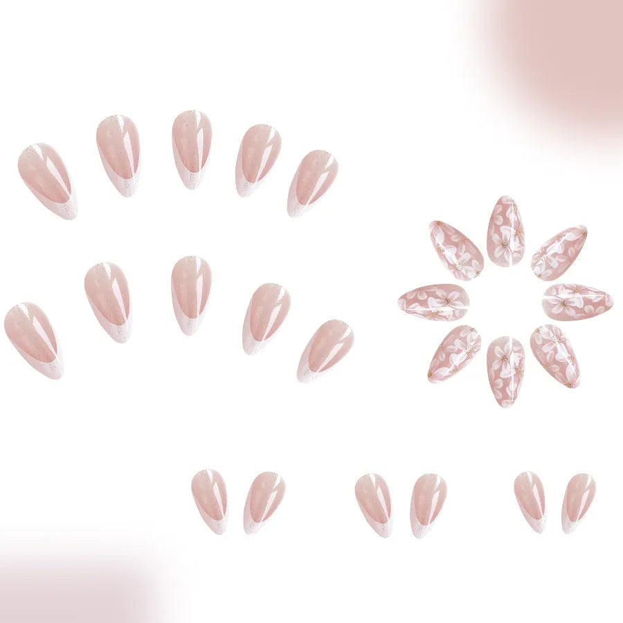 Short glossy almond French style press-on nails with glittering powder flowers in colour C625