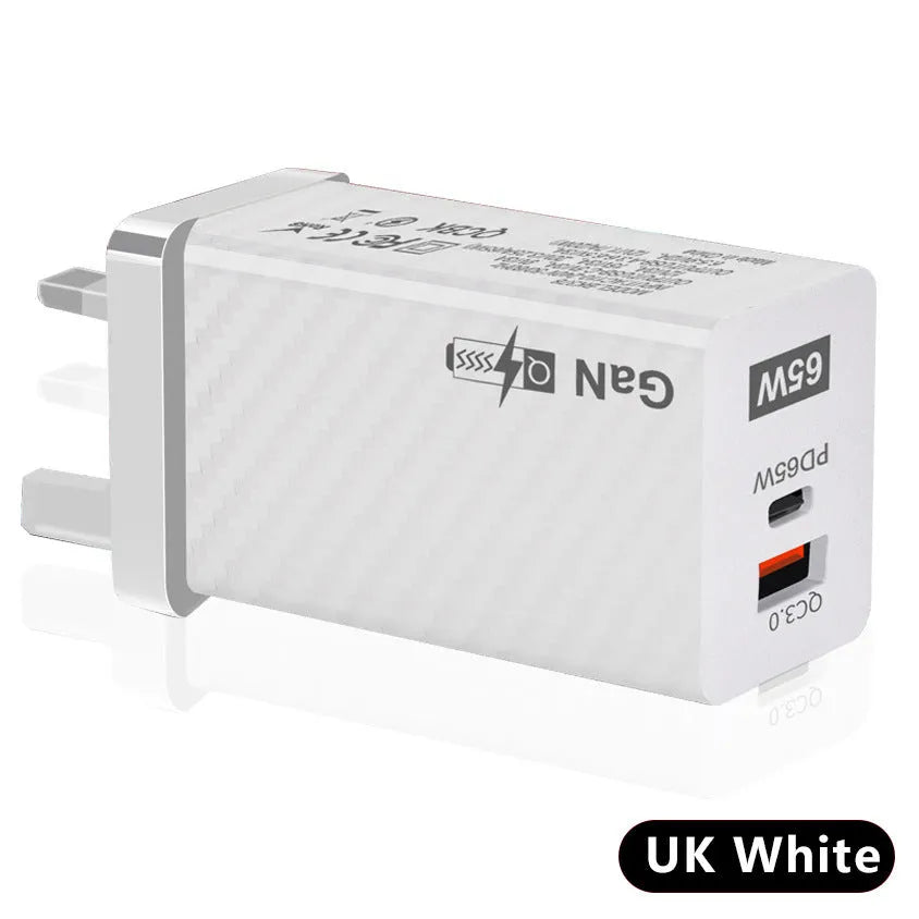 65W GaN universal laptop charger with UK, US, and EU plug heads in black or white