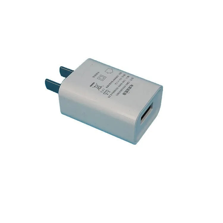 Slim white 5V 1A USB wall charger with CE and FCC marks on a white background.