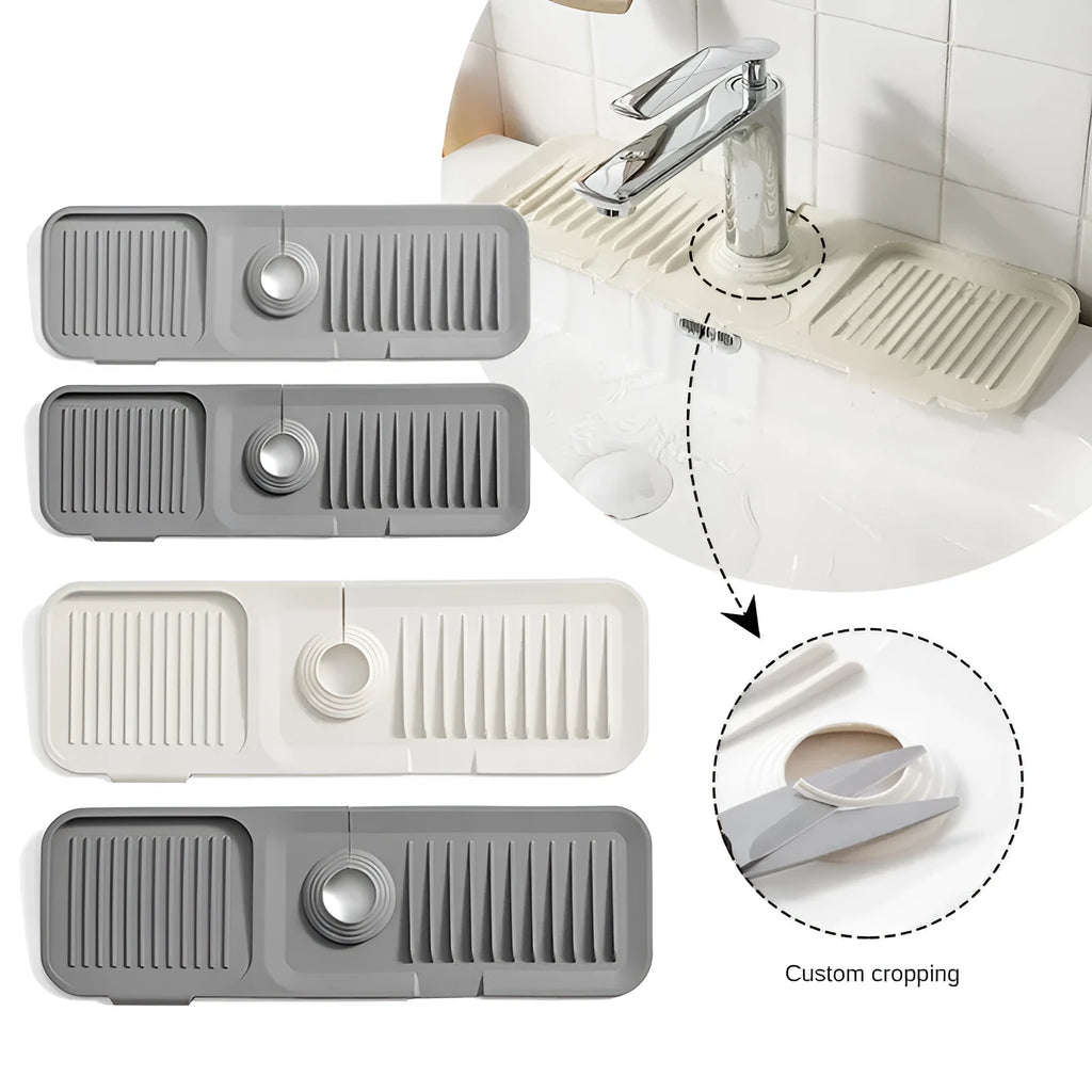 Beige silicone sink splash guard with sloped design and drainage channels placed under a kitchen faucet.