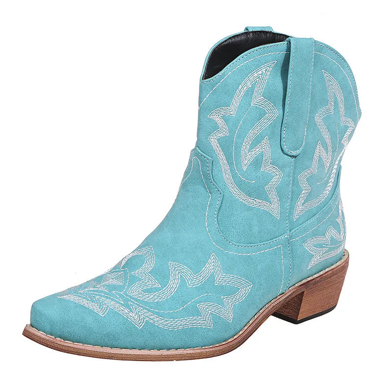 Blue women's Western cowgirl boots with embroidery detail, low wedge heel, and pointed toe.