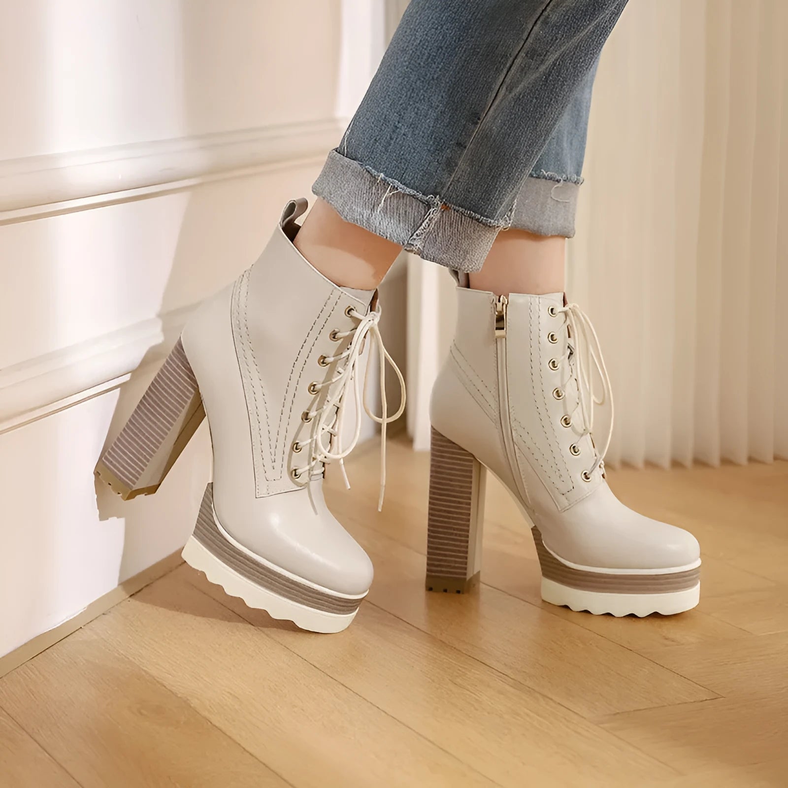 Women's black chunky heel waterproof ankle boots with a side zip on a white background.