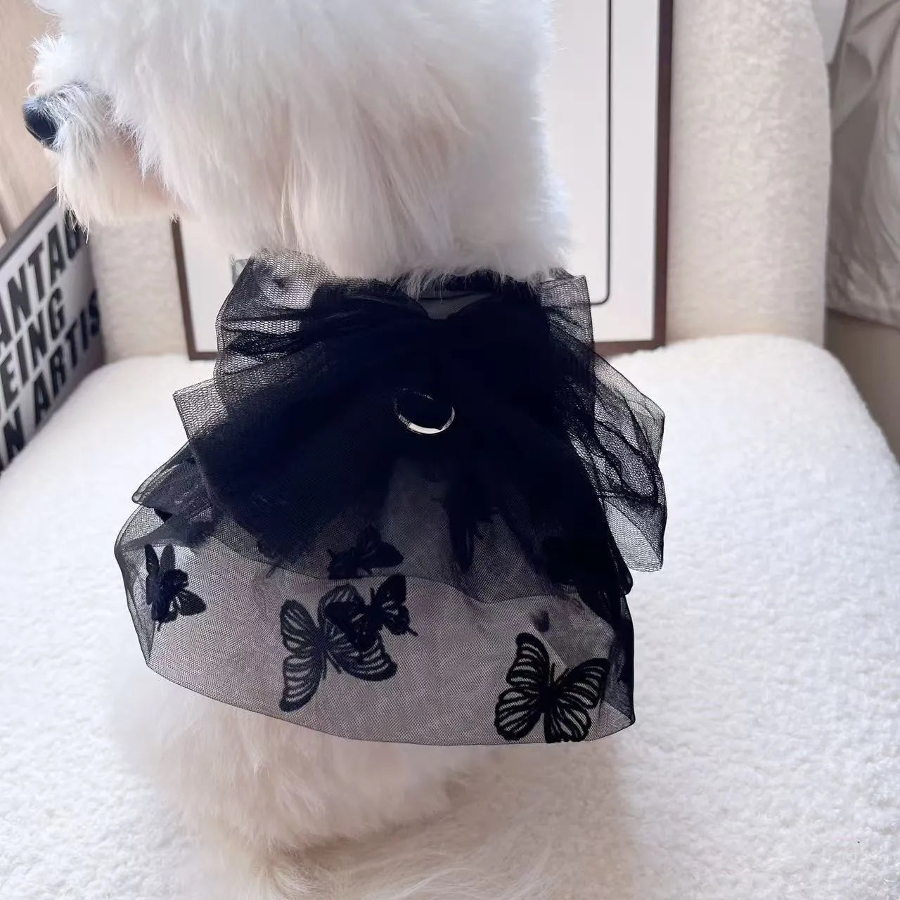 Black gauze princess skirt for a small dog on a mannequin, showing tulle material.