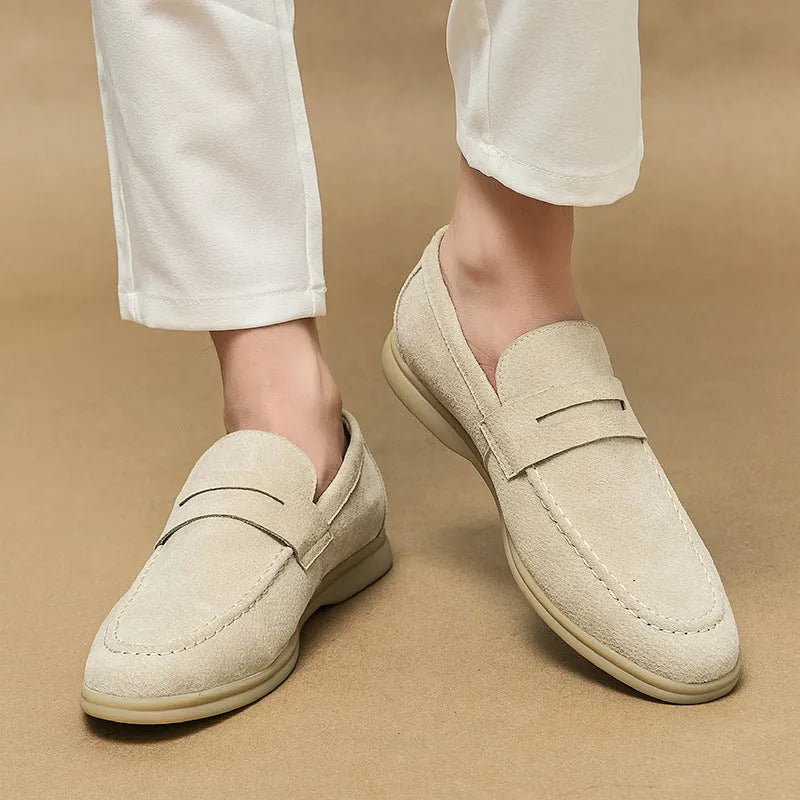 Men's black slip-on leather casual shoes with round toe and mid heel on a rubber sole.