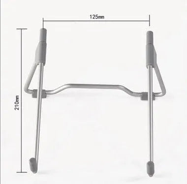 Grey adjustable angle aluminium alloy and plastic stand holding a mobile phone and a laptop on a desk.