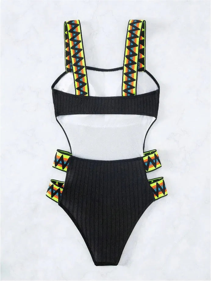 Black and orange solid colour women's one-piece polyester swimsuit on size chart.