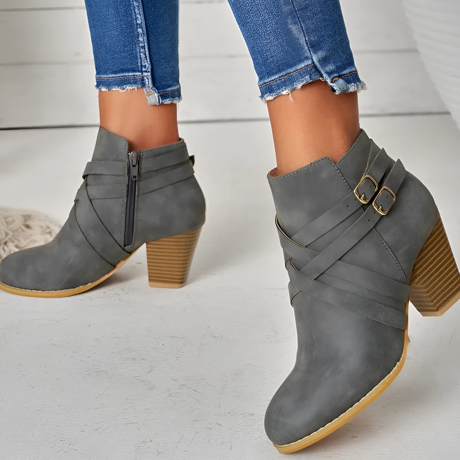 Women's short ankle boots with a side zipper and 7cm heel, shown in grey colour.
