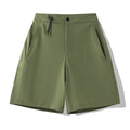 Men's quick-drying sports shorts in khaki colour with a four-sided elastic waistband, shown flat.