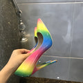 Rainbow multicolour patent leather women's stiletto heels with a pointed toe.