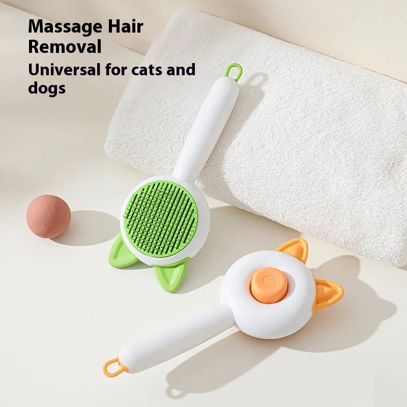Greenish white cat grooming brush with stainless steel teeth and a self-cleaning button on the handle.
