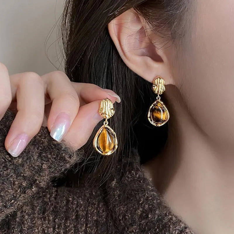 Three pairs of handmade electroplated alloy holiday earrings with geometric shapes and tassel elements