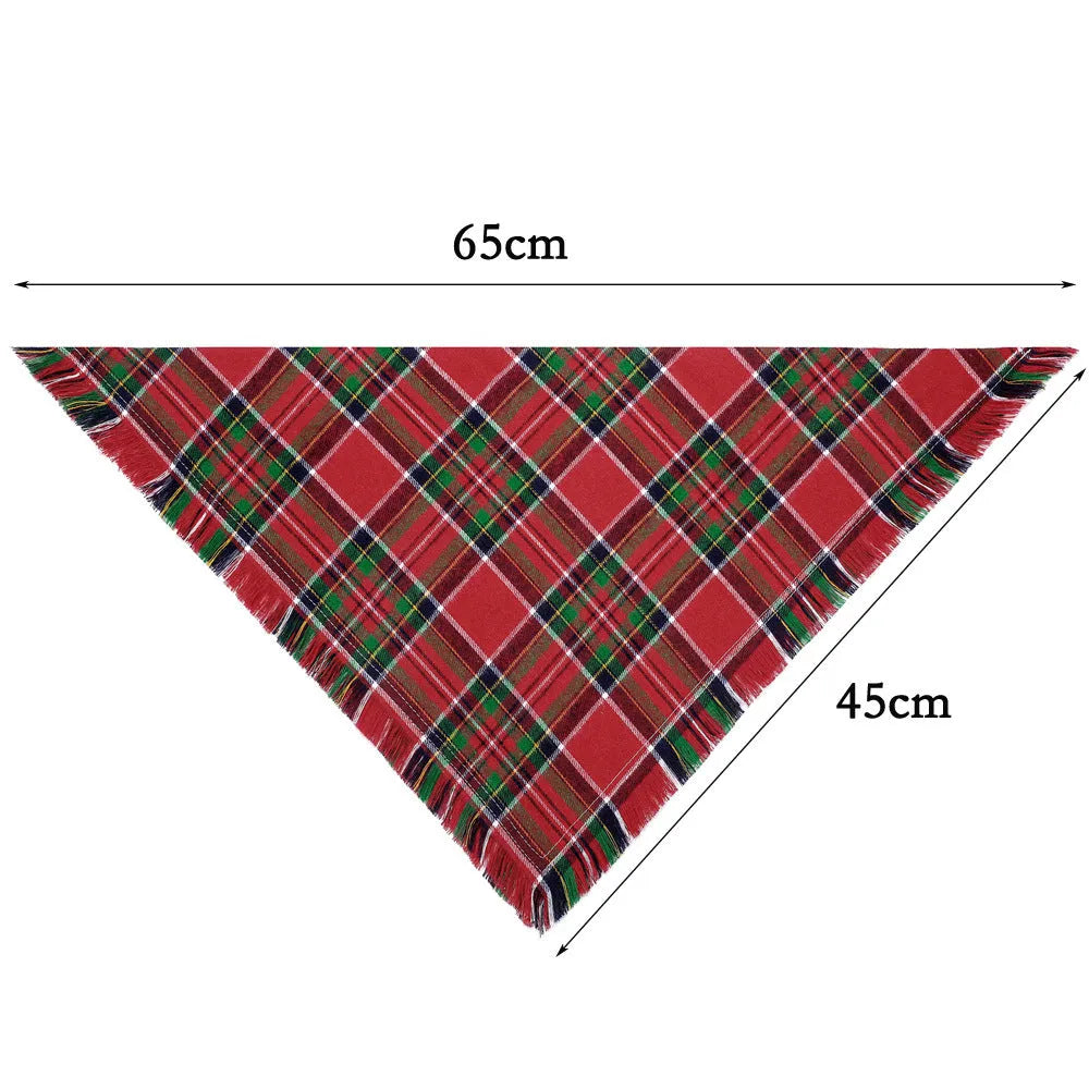 Plaid triangle dog bandana with tassel edges in autumn colours like brown, green, and orange.