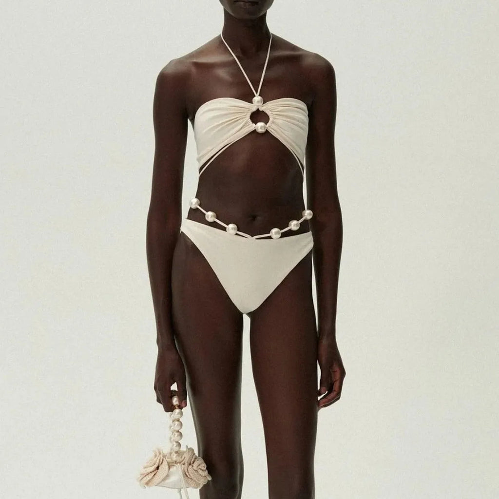 Women's black split bikini swimsuit with lace-up detailing and briefs style design