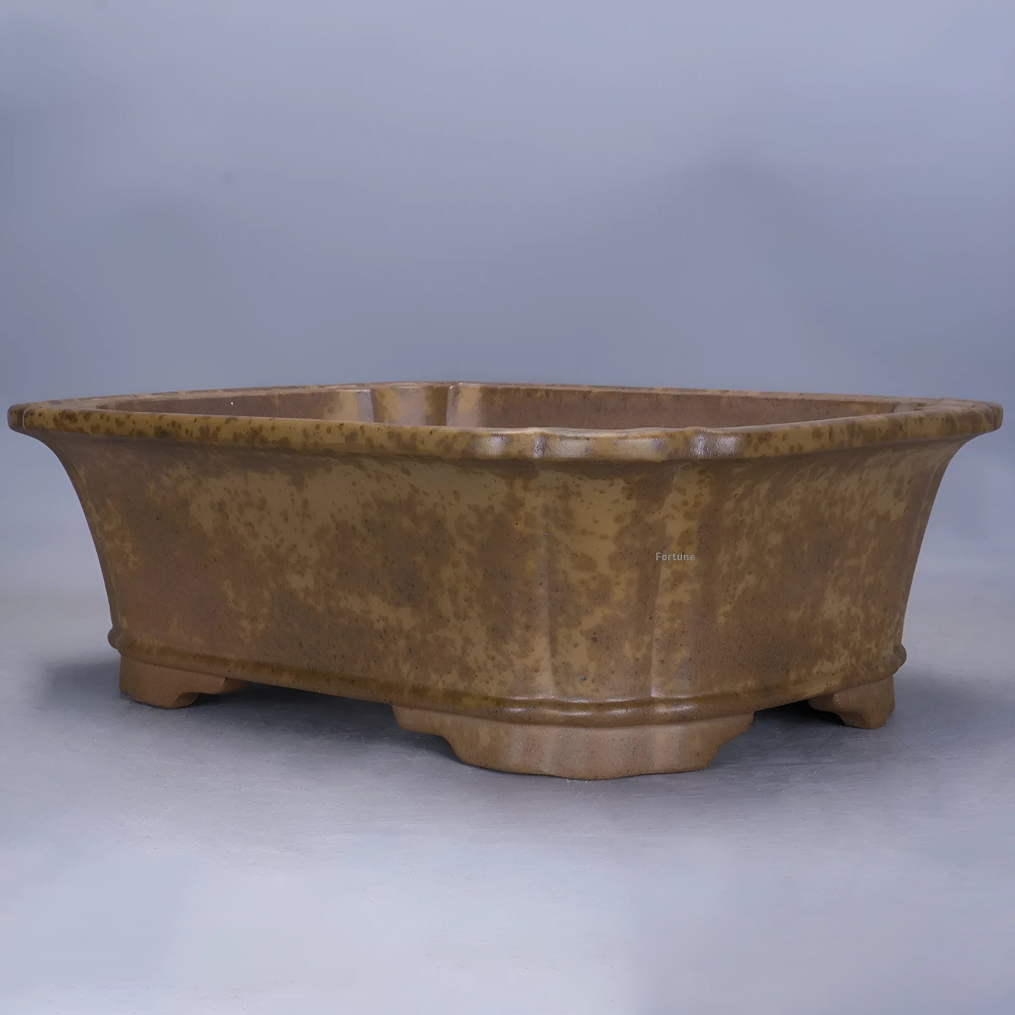 Large rectangular purple sand flowerpot with a double pumping angle design on a floor.