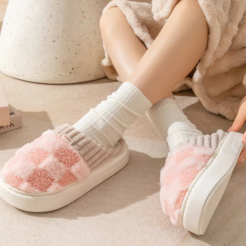 Women's plaid plush slippers in coffee colour with a soft upper, plush lining, and textured PVC sole.