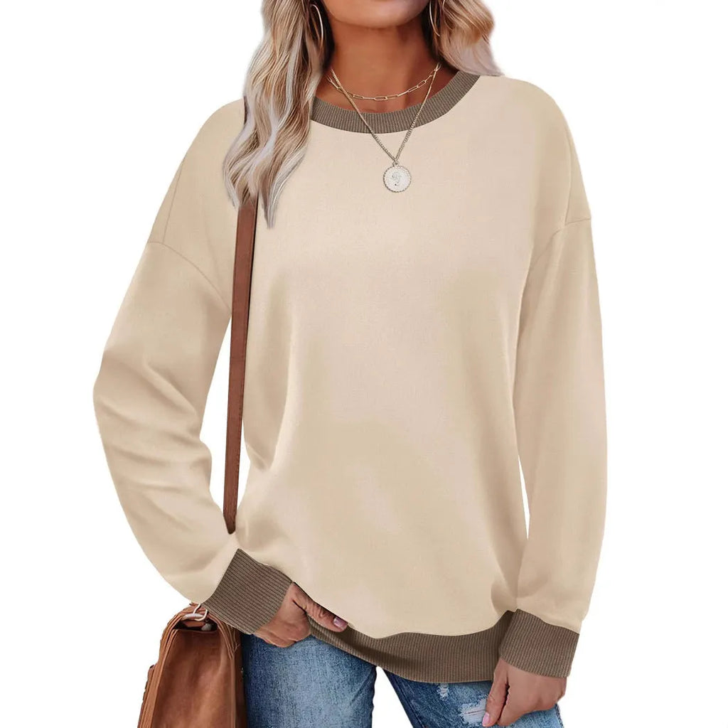 Women's loose striped long-sleeved top in polyester showing round neck and regular sleeve construction