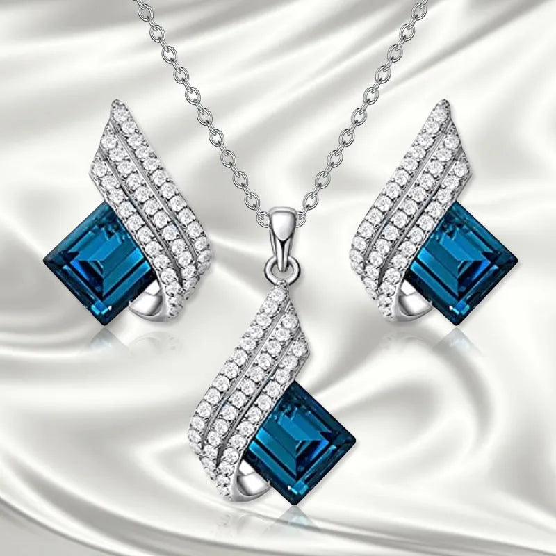 Alloy necklace with glass pendant and matching ear studs featuring cross chain design in jewellery set