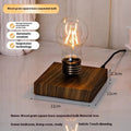 Creative small desktop night lamp with a suspension bulb and iron art body on a wood grain base.