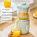 Fresh green portable USB electric juicer for oranges and lemons on a kitchen counter