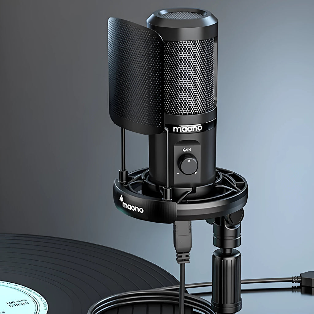 Black USB condenser microphone on a tripod with shock mount, next to a USB cable.