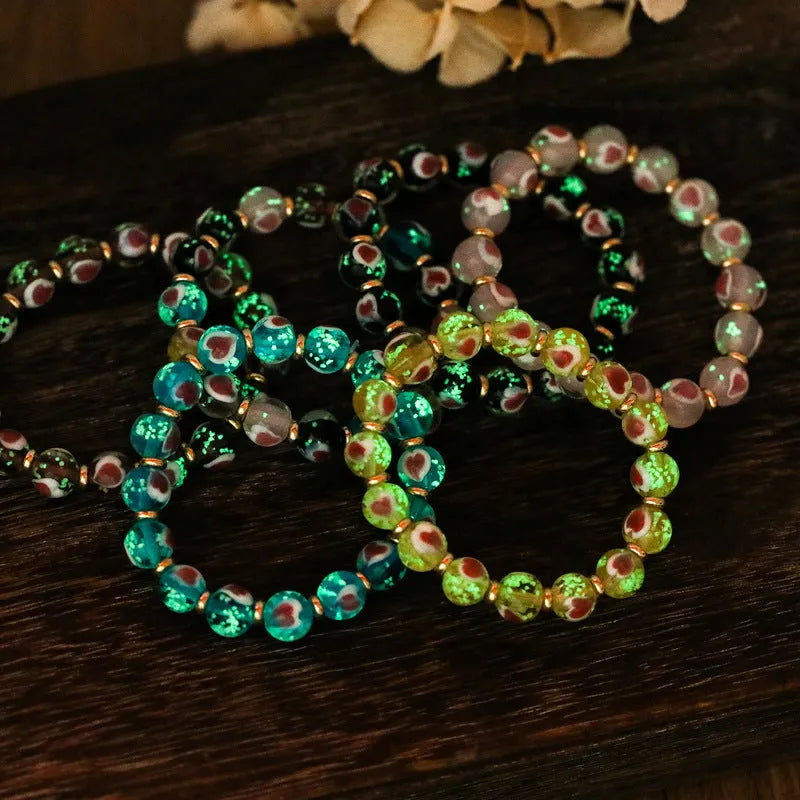 Handmade heart-shaped glass bracelet with swallowing gold beast pattern in ancient fluorescent glaze