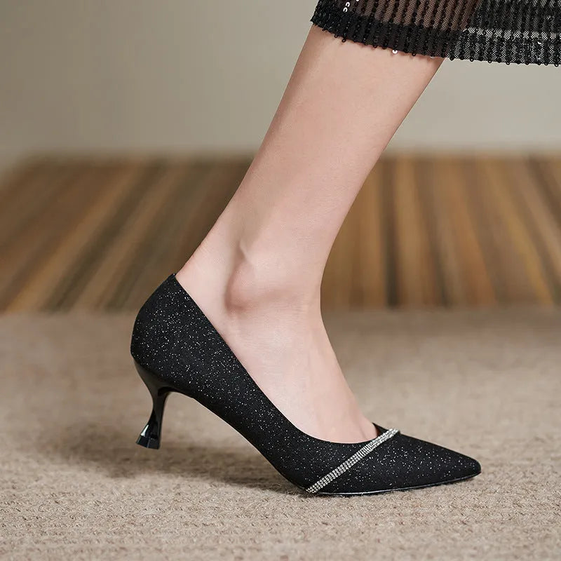 Black sequined women's high heel pumps with a 7cm stiletto heel and low upper.