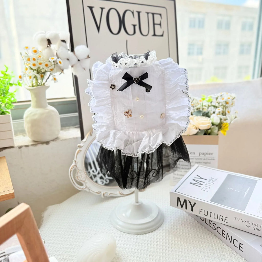White polyester waltz gauze skirt princess dress for a small dog on a hanger.