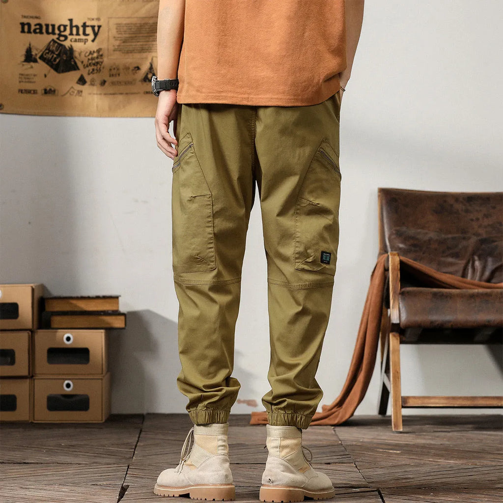 Men's tapered harem trousers in cotton with banded ankle and elastic waist in solid colour options.