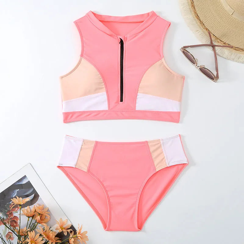 Pink high waist bikini swimsuit with briefs and a bra on a neutral background.