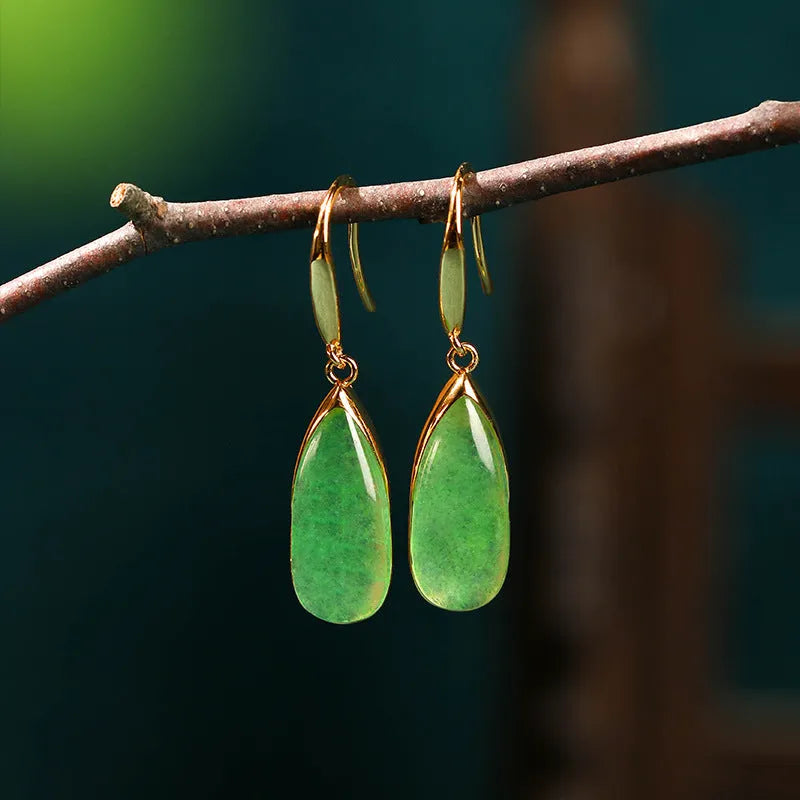 A pair of jade green geometric water droplet earrings in a Chinese style with an electroplated copper finish.