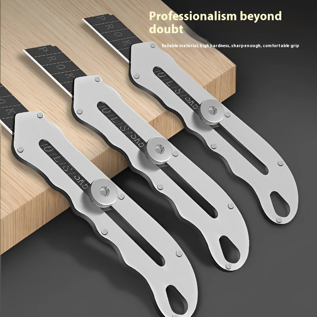Stainless steel folding art knife with a black blade, shown with a set of long and trapezoidal spare blades.