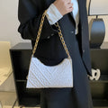 Vertical brown PU leather women's shoulder bag with a pleated front, chain strap, and soft handle.