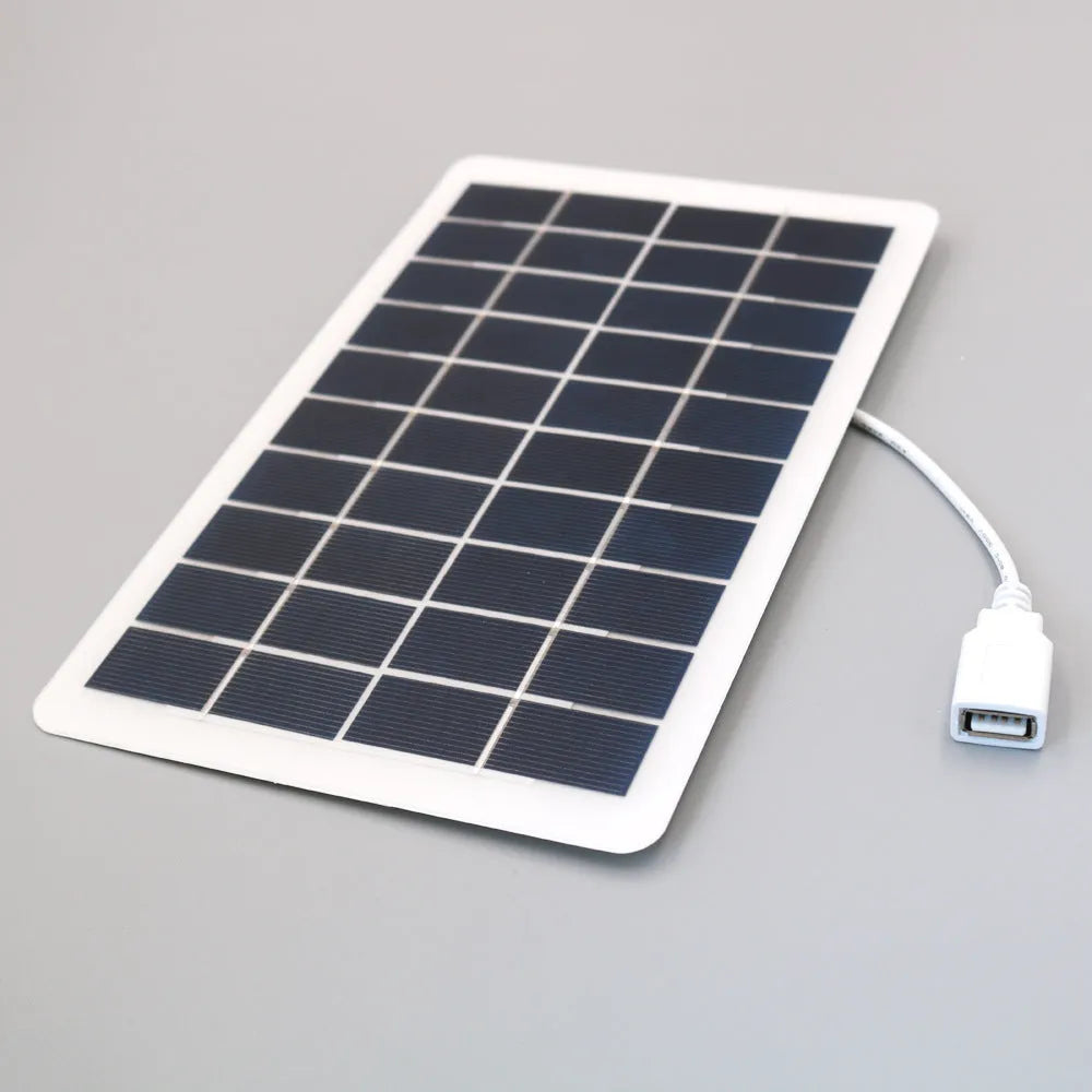 Black portable solar panel charger with USB port for mobile phone charging
