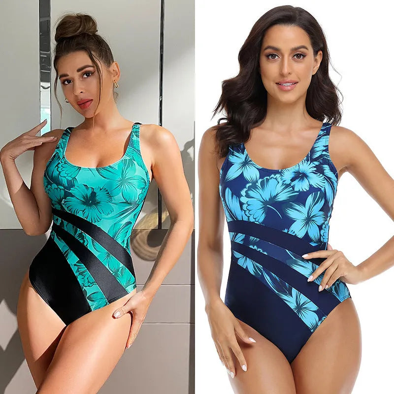 Blue and green printed conservative one-piece swimsuit for women on a hanger.