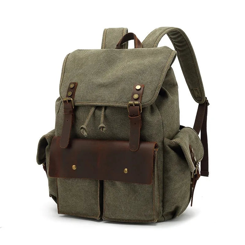 Retro canvas backpack in khaki colour with antique bronze hardware, showing front compartments and straps.
