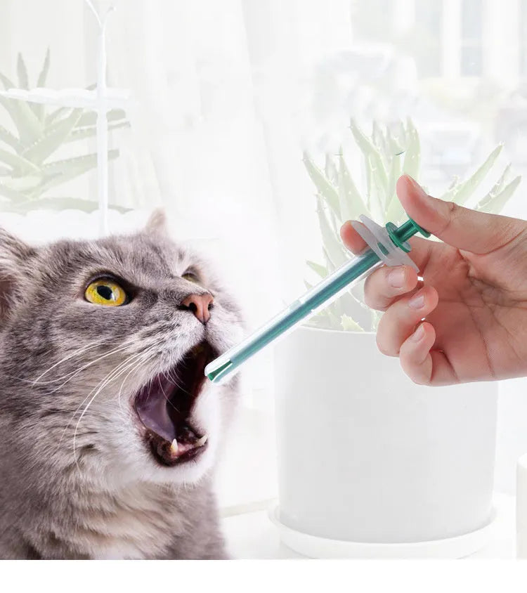 Two silicone pet pill shooters with soft tips for feeding medication to cats and dogs.
