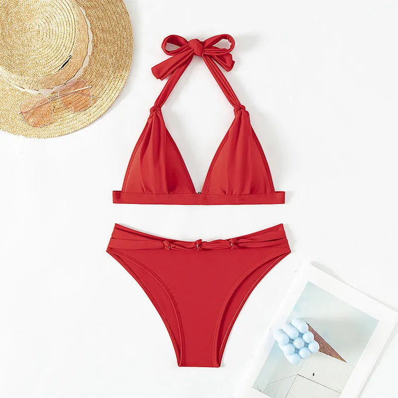 Red women's lace-up halterneck bikini top with matching split shorts.