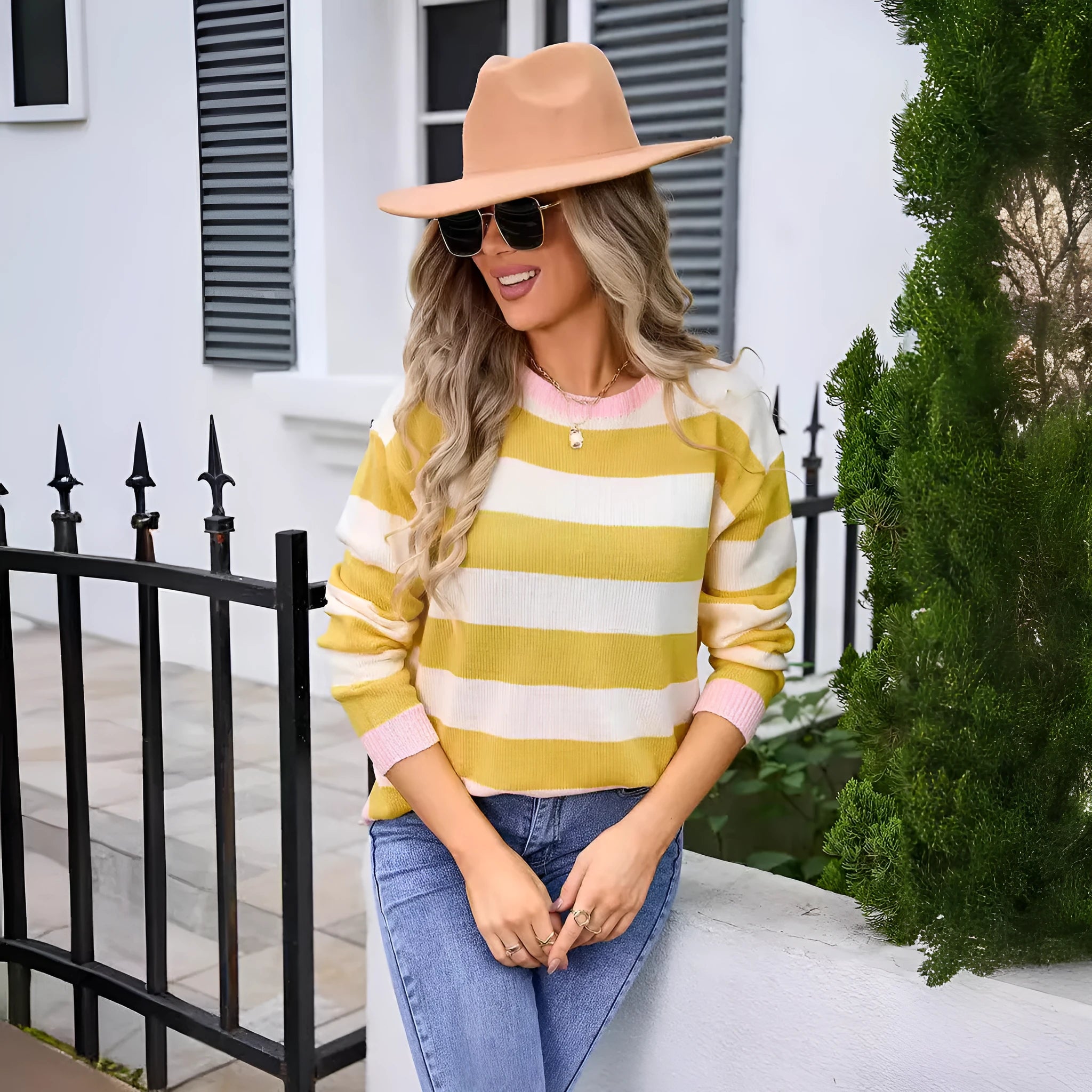 Women's loose long sleeve round neck acrylic sweater in striped or plaid pattern